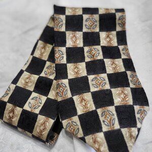 Claiborne Tie with Black and Gold Designs.